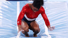 Simone Biles of Team United States stumbles upon landing after competing in vault during the Women's Team Final on day four of the Tokyo 2020 Olympic Games.