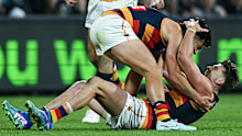 Ben Keays celebrates a goal with Adelaide Crows teammate Josh Rachele.