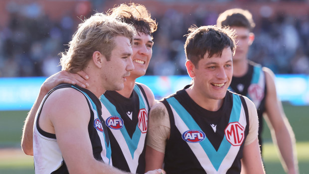 Jason Horne-Francis, Connor Rozee and Zak Butters of the Power celebrate their win over the Western Bulldogs.
