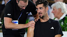 Thanasi Kokkinakis of Australia in the hands of a physio during his match against Sebastian Korda of the USA during day one of the 2026 Adelaide International at Memorial Drive on January 12, 2026 in Adelaide, Australia. (Photo by Sarah Reed/Getty Images)