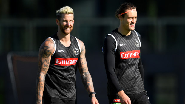 Jeremy Howe and Darcy Moore during a Collingwood Magpies training session.