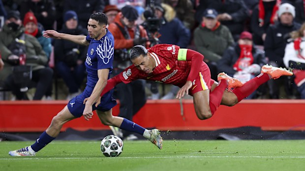 Achraf Hakimi of Paris Saint-Germain and Virgil van Dijk of Liverpool challenge.