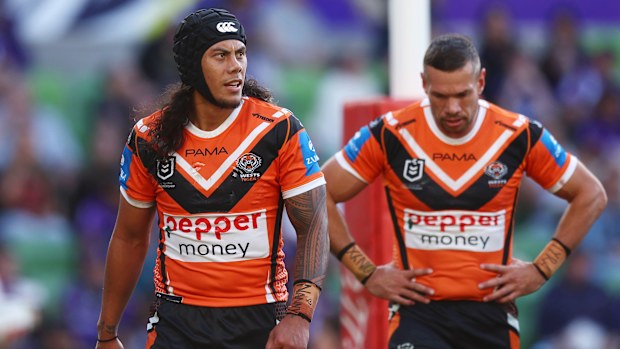 Jarome Luai of the Tigers looks dejected against the Storm.