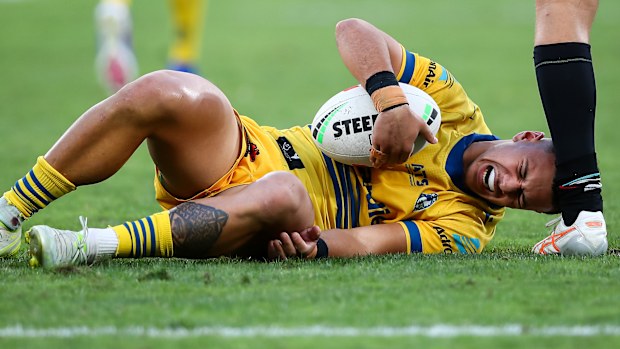 Isaiah Iongi reacts after a hip-drop tackle.