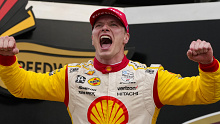 Josef Newgarden celebrates after winning the 108th Indianapolis 500.