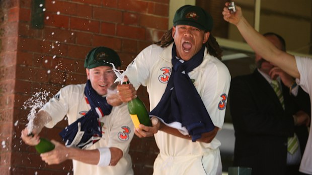 Australian players Andrew Symonds and Michael Clarke spray champagne after winning the 2007 Ashes series.