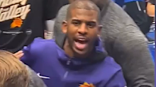 Chris Paul was held back by security.