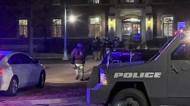 Police investigate the scene of a shooting at Berkey Hall on the campus of Michigan State University.
