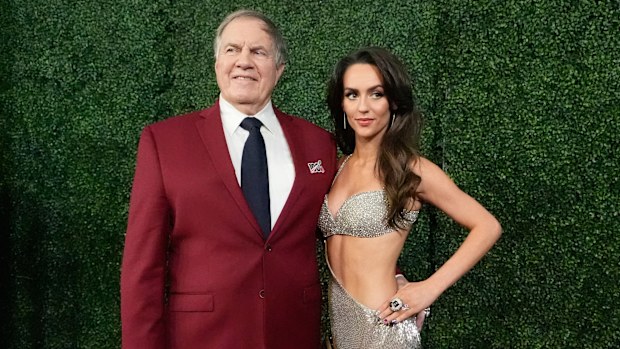Former NFL coach Bill Belichick and girlfriend Jordon Hudson pose for a photo.