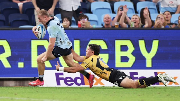 Max Jorgensen of the Waratahs scores a try.