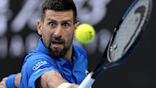 Novak Djokovic of Serbia returns a shot from Jiri Lehecka of the Czech Republic during their fourth round match at the Australian Open tennis championship in Melbourne, Australia, Sunday, January 19, 2025.
