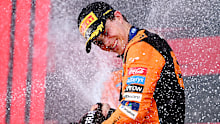 Race winner Oscar Piastri of Australia and McLaren celebrates on the podium during the F1 Grand Prix of Azerbaijan at Baku City Circuit on September 15, 2024 in Baku, Azerbaijan. (Photo by Dan Mullan/Getty Images)