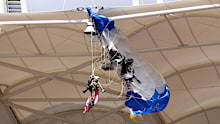 A parachutist who became snagged on the roof of the stadium.