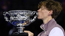 Jannik Sinner of Italy kisses the Norman Brookes Challenge Cup aloft after defeating Daniil Medvedev of Russia in the men's singles final at the Australian Open tennis championships at Melbourne Park, in Melbourne, Australia, Sunday, January 28, 2024.