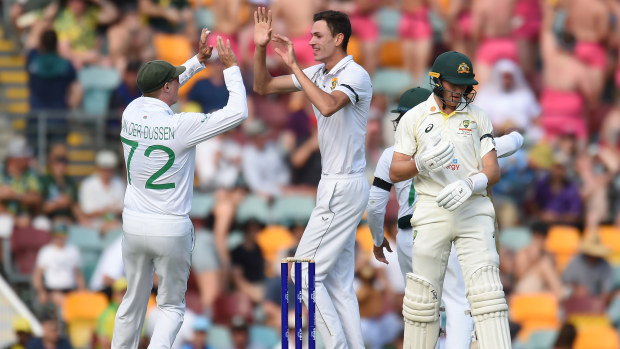 Marnus Labuschagne of Australia reacts as Marco Jansen of South Africa celebrates with Rassie van der Dussen of South Africa after taking his wicket for 11 runs during day one of the First Test match between Australia and South Africa at The Gabba on December 17, 2022 in Brisbane, Australia. (Photo by Albert Perez/Getty Images)
