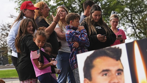Supporters gather at a memorial after Turning Point USA CEO and co-founder Charlie Kirk was shot and killed at Utah Valley University, Saturday, Sept. 13, 2025, in Orem, Utah. (AP Photo/Lindsey Wasson)