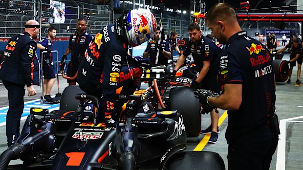 Max Verstappen of the Netherlands and Oracle Red Bull Racing climbs from his car in the Pitlane during qualifying ahead of the F1 Grand Prix of Singapore at Marina Bay Street Circuit on September 16, 2023 in Singapore, Singapore. (Photo by Mark Thompson/Getty Images)