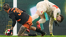 Dortmund goalkeeper Gregor Kobel loses the ball to Donetsk's Marlon Gomes, who scores.