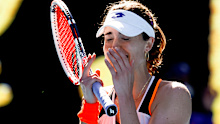 Alize Cornet of France reacts after defeating Simona Halep of Romania in their fourth round match at the Australian Open tennis championships in Melbourne, Australia, Monday, Jan. 24, 2022.(AP Photo/Tertius Pickard)
