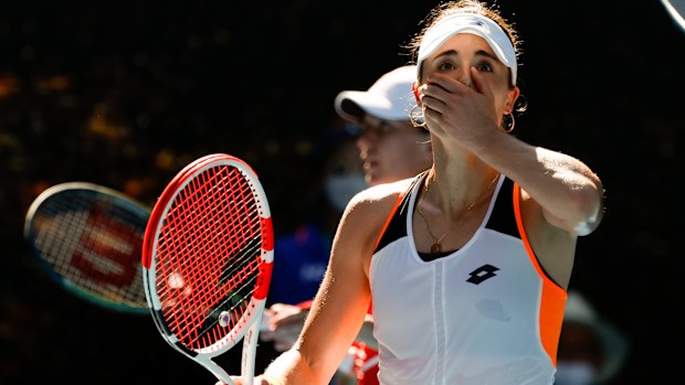 Alize Cornet of France reacts after defeating Simona Halep of Romania in their fourth round match at the Australian Open.