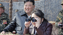 In this photo provided by the North Korean government, North Korean leader Kim Jong Un, center left, and his daughter inspect a training of the Korean People's Army airborne units in North Korea Friday, March 15, 2024. Independent journalists were not given access to cover the event depicted in this image distributed by the North Korean government. The content of this image is as provided and cannot be independently verified. Korean language watermark on image as provided by source reads: "KCNA"