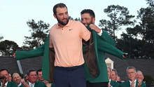 AUGUSTA, GEORGIA - APRIL 14: Scottie Scheffler of the United States is awarded the Green Jacket by 2023 Masters champion Jon Rahm of Spain during the Green Jacket Ceremony after Scheffler won the 2024 Masters Tournament at Augusta National Golf Club on April 14, 2024 in Augusta, Georgia. (Photo by Jamie Squire/Getty Images)