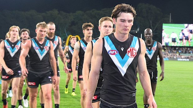 Connor Rozee of the Power leads his team off after their loss to Geelong.