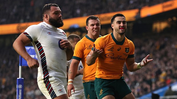 Tom Wright of Australia celebrates scoring his team's first try.