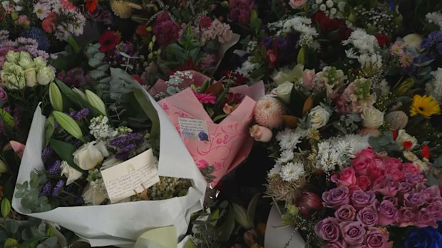 A floral tribute at Wangaratta Police Station continues to grow in honour of two officers killed in the line of duty.