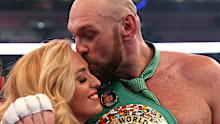 LONDON, ENGLAND - APRIL 23: Tyson Fury celebrates victory with his wife Paris Fury after the WBC World Heavyweight Title Fight between Tyson Fury and Dillian Whyte at Wembley Stadium on April 23, 2022 in London, England. (Photo by Julian Finney/Getty Images)