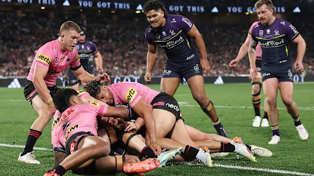Jack Howarth of the Storm is held up over the try-line during the 2024 NRL Grand Final match between the Melbourne Storm and the Penrith Panthers at Accor Stadium on October 06, 2024, in Sydney, Australia. (Photo by Cameron Spencer/Getty Images)