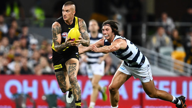 Dustin Martin of the Tigers runs the ball during the 2020 AFL Grand Final match between the Richmond Tigers and the Geelong Cats at The Gabba on October 24, 2020 in Brisbane, Australia. (Photo by Quinn Rooney/Getty Images)