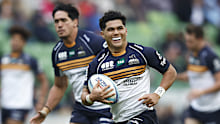 Noah Lolesio of the Brumbies runs in to score a try.