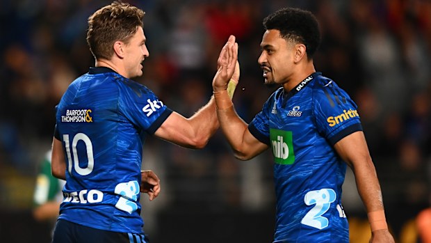 Beauden Barrett of the Blues celebrates after scoring a try with Stephen Perofeta.