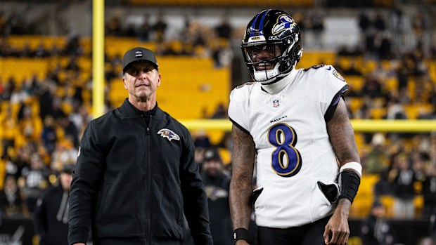 Lamar Jackson #8 of the Baltimore Ravens shares a moment with Baltimore Ravens head coach John Harbaugh prior to an NFL football game against the Pittsburgh Steelers at Acrisure Stadium on January 04, 2026 in Pittsburgh, Pennsylvania. (Photo by Michael Owens/Getty Images)