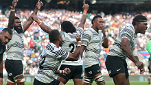 Fiji celebrate their historic victory at the final whistle during against England at Twickenham.