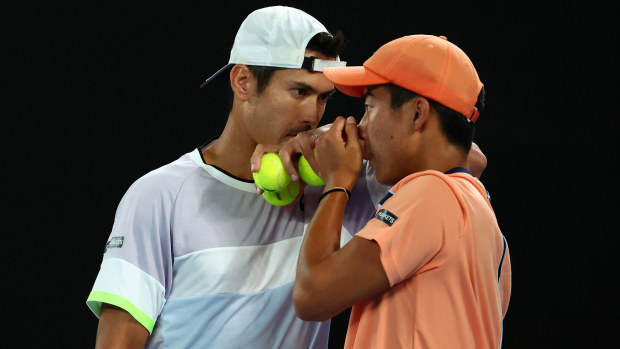 Jason Kubler and Rinky Hijikata of Australia converse in the Mens Doubles Final against Hugo Nys of France and Jan Zielinski of Poland during day 13 of the 2023 Australian Open at Melbourne Park on January 28, 2023 in Melbourne, Australia. (Photo by Graham Denholm/Getty Images)