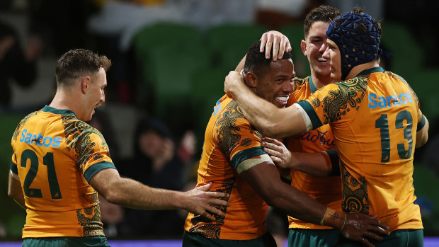 Filipo Daugunu of the Wallabies celebrates with after scoring a try.