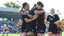 Katelyn Vahaakolo of the Black Ferns celebrates with teammates after scoring a try.