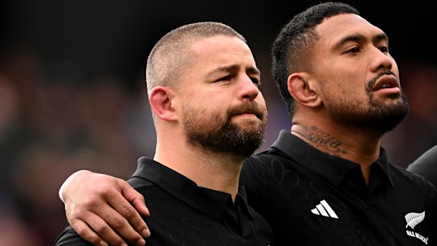 Dane Coles and Ardie Savea of New Zealand stand for the national anthems.