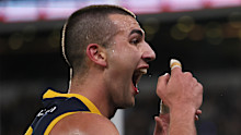 Josh Rachele gestures to the crowd after scoring a goal against Port Adelaide. 