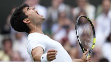 Carlos Alcaraz of Spain celebrates after defeating Daniil Medvedev of Russia in their semifinal match at the Wimbledon tennis championships in London, Friday, July 12, 2024. 