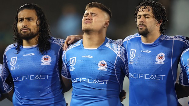 Bunty Afoa, Josh Schuster and Josh Aloiai of Samoa sing the national anthem ahead of their clash with the Cook Islands in June. 