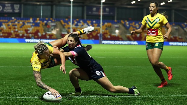 Julia Robinson goes over to score the Jillaroos' hat trick try against the Kiwi ferns.