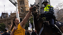 The man charged with punching a NSW Police horse has been kept behind bars and in isolation for refusing a COVID-19 test.