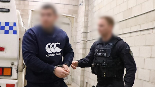 An alleged Rebels bikie member has been charged after police uncovered a video of a caged cat being fatally shot at point-blank range on his phone.
