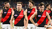 Essendon players leave the ground following their loss to Carlton earlier in the season.