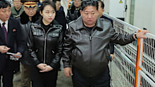 North Korean leader Kim Jong Un and his teenage daughter fired pistols during an inspection of a light munitions factory, as he pushes to modernise conventional forces after years of focus on nuclear weapons.