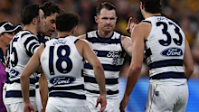 Patrick Dangerfield celebrates with teammates after kicking a goal.