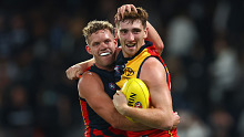 MELBOURNE, AUSTRALIA - APRIL 13: Mark Keane and Mitchell Hinge of the Crows celebrate winning the round five AFL match between Carlton Blues and Adelaide Crows at Marvel Stadium, on April 13, 2024, in Melbourne, Australia. (Photo by Quinn Rooney/Getty Images)
